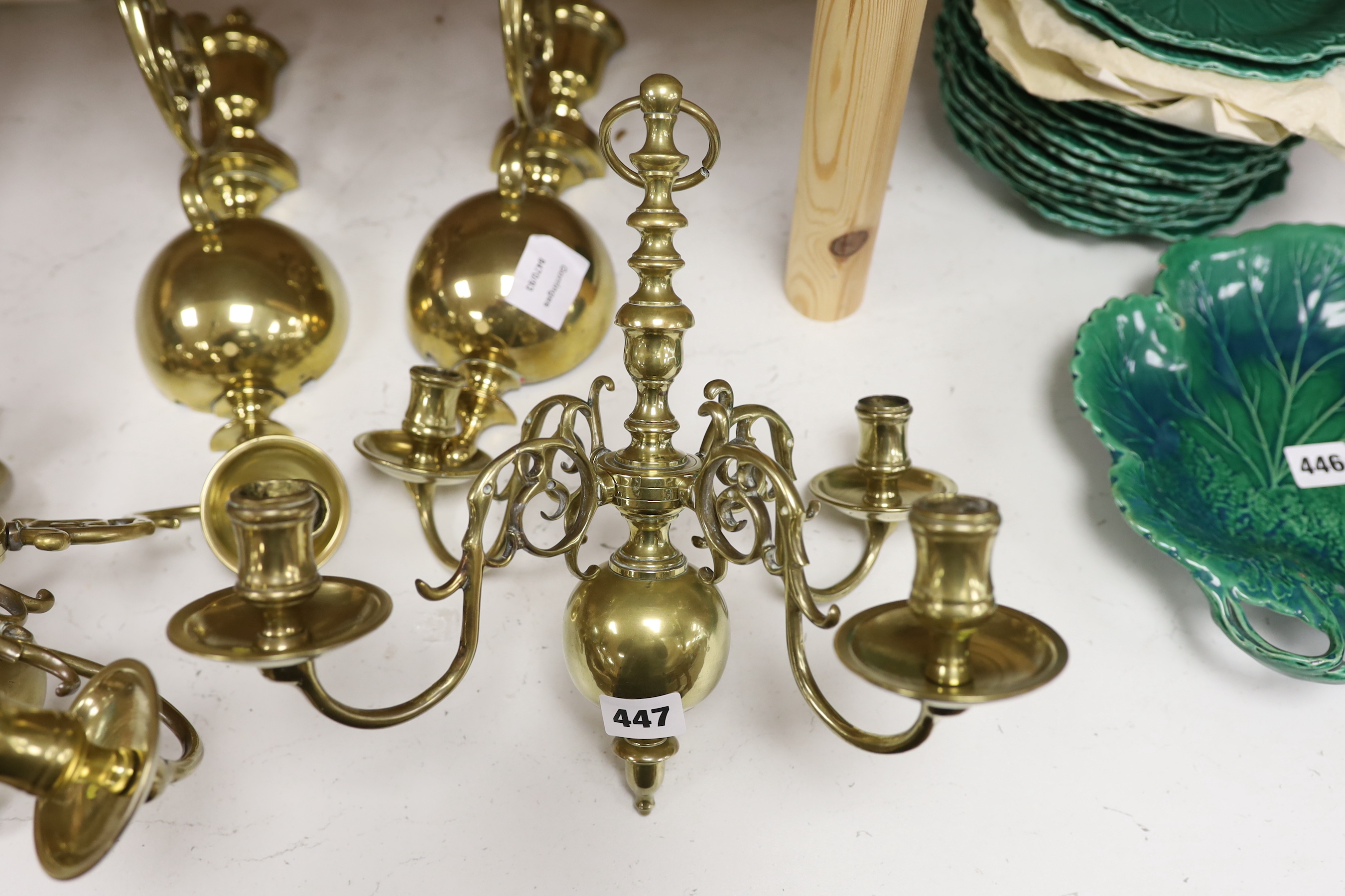 A pair of 19th century Dutch brass wall lights, each formed as a four branch chandelier with baluster stems supported by matching brackets, 36cm high